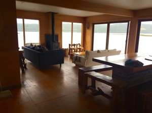 The common area with a fireplace and beautiful views of the river.