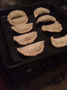 The products pre-oven. You can tell which are mine (not so great folding job) and which are Lorena's (perfectly prepared empanadas)